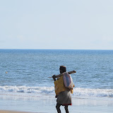  &ndash; Fula Sufi man praying beads as he walks the beach ....© 2008 NHA Photos, Vicki Hicks, Photographer