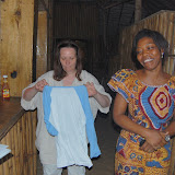  &ndash; Vicki's shirt had a photo of Ramada on it, so she took it off and gave it to the owner, Ramatu. …. © 2008 NHA Photos, James Mansaray: Photographer