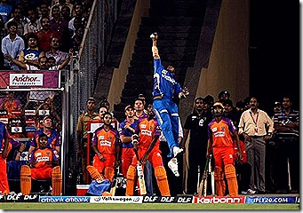Mumbai Indians' Kieron Pollard jumps to catch the ball near the boundary line