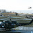 Heliporto do comando da KFOR no Kosovo. Bell UH-1 italiano em primeiro plano e Sikorsky UH-60 Black Hawk do US Army no ar