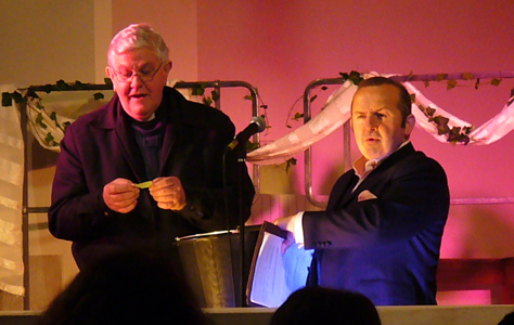 Fr. Michael Turner drawing the raffle, with host Terence Frisch