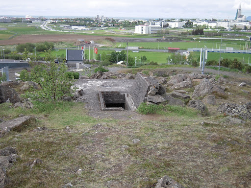 An old bunker concealed among the rocks.