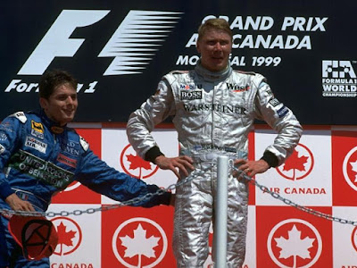 Джанкарло Физикелла и Мика Хаккинен на подиуме Гран-при Канады 1999
