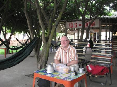 Dave Fox's coffee break at a roadside cafe in Vietnam. Photo by Tran Phuc