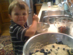 Demonstrating how to mix and stir with a smile.