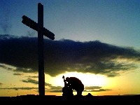 [guy_kneeling_at_cross[3].jpg]