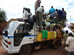 Passangers boarding truck transport travelling from Lira to Kitgum