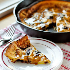 Roasted Cherry Dutch Baby with Brown Sugar-Cinnamon Sauce