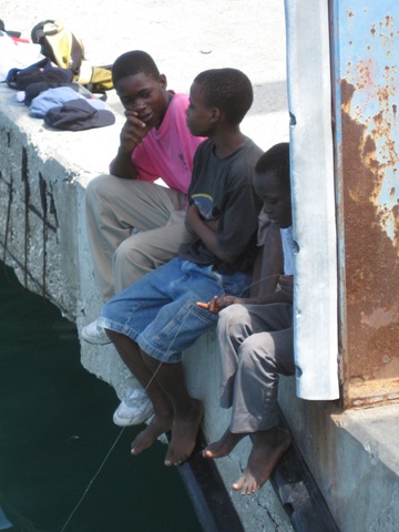 [Boys fishing at wharf in Carries.jpg]