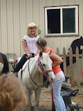Melissa, the actual birthday girl, on a pony.