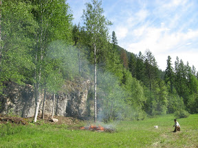 Dad burning the brush at the bouldering wall (it's getting close to being finished)