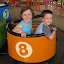 Natalie and Eli getting ready to ride the kiddie whip ride at Kings Island.