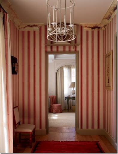  to the bedroom has hand blocked red and white striped wallpaper.