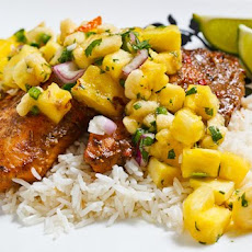 Jerk Fish on Coconut Rice Topped with Banana and Pineapple Salsa