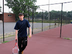Playing tennis.