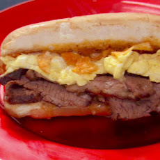 Beef Brisket Grinder with 3 Peppercorn Glaze, Steak Sauce Mayo, and Cheddar-Scrambled Eggs