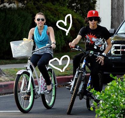 Miley Cyrus and rumored boyfriend Adam Sevani Bike Riding picture