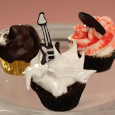 Chocolate Fudge Cupcakes filled with Chocolate Fudge Cookie Bar and Marshmallow Meringue Frosting