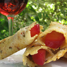 Parmesan Rosemary Tuille with Rosé-Poached Plums
