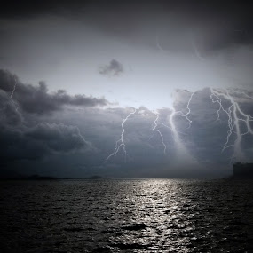 lightning at sunset by Michelle Meenawong - Landscapes Weather ( clouds, lightning, sky, nature, sunset, sea, weather )