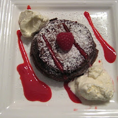 Decadent Molten Chocolate with raspberries and ice cream