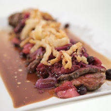New York Strip Steak with Tri-Berry Relish, Crispy Onion Strings and Baked Macaroni and Cheese with Prosciutto and Truffle Oil