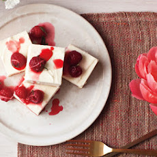 Cheesecake with Ginger-Lime Candied Raspberries