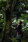 Aya looks up a tall tree in Shizen Kyoikuen