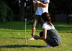 Aya waits while rival Chance (brother of Genny) makes his throw