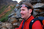 Jason takes a breather on an alpine ledge