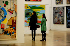 The young Japanese ladies peruse this second tier gallery at The National Art Center, Tokyo