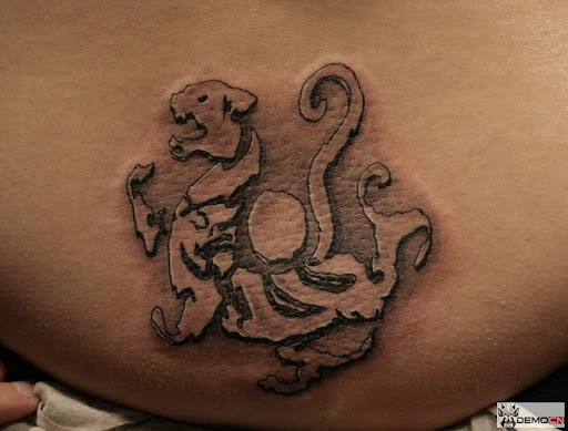 This free tattoo design seems like a tiger or dragon.