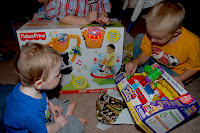 Sam's 1st Bday &ndash; Jacob shows Sam how to use the toy he got for him.
