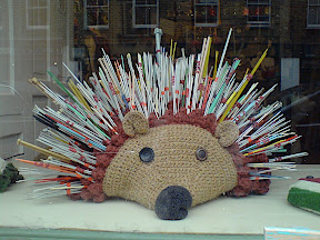 knitted hedgehog with knitting needle spines