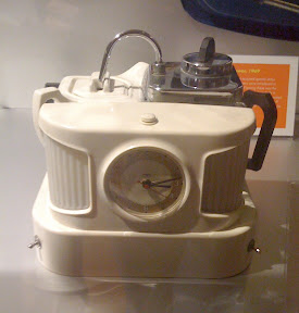 box with clock and small jug