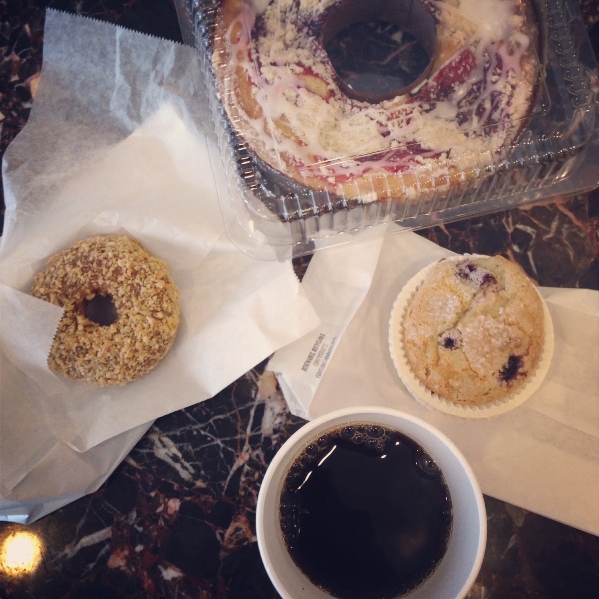 All gluten free baked goodies!  Peanut covered donut, blueberry muffin, and a raspberry ring cake!  