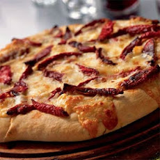 Flatbread with Oven-Dried Tomatoes, Rosemary, and Fontina