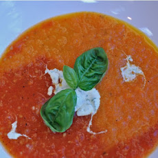 Roasted Carrot & Tomato Soup with a Topping of Basil Infused Creme Fraiche