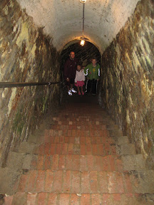 A tunnel that leads you through a thick fort wall