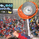 Bins of Ultraman finger puppets at the Ultraman store under Tokyo station. The sign says “Don't mix the heroes and the monsters! Please.” Bins of Ultraman finger puppets at the Ultraman store under Tokyo station. The sign says “Don't mix the heroes and the monsters! Please.”