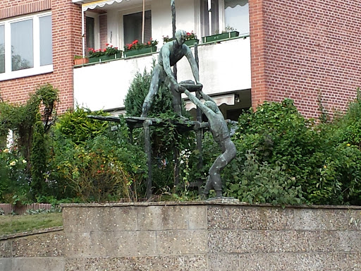 Statue: Handwerker auf Gerüst