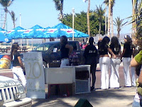 skinny girls promoting coke zero.   ... and one chubby one completely covered in black.