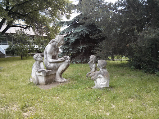 Sculpture of Woman Reading for Children
