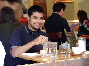 Enjoying a cappuccino at a cafe at the corner of Broadway and...I forget.