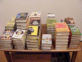 These books aren't real books, just props for this exhibit. Even the boxes under the table contain the props. The authors of the books were names like