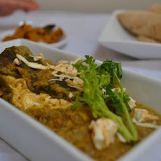 Feta stuffed poblano peppers in a sesame peanut sauce