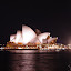 Night view of the Sydney Opera House across Sydney Cove from Circular Quay near The Rocks