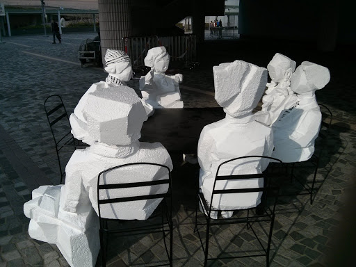 At a Table Sculpture