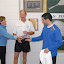 Kate awards Mike his trophies