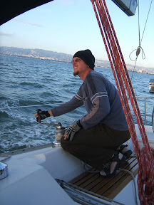 Jason fusses with sail trim